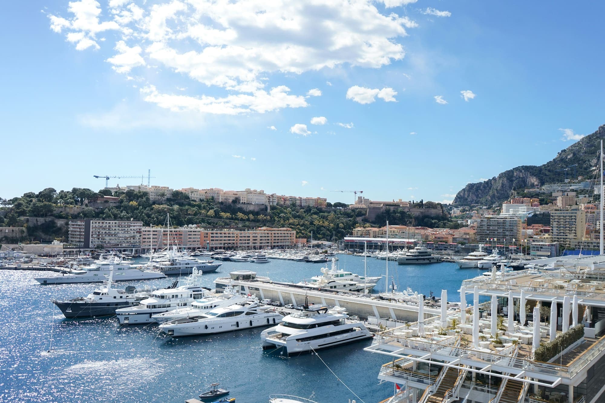 Superyachts moored in a Mediterranean marina, a typical superyacht crew hub